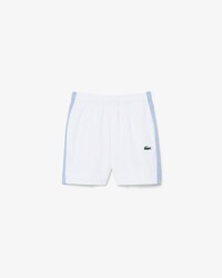 Pantal&oacute;n corto deportivo de tafet&aacute;n diamantado con bloques de color
