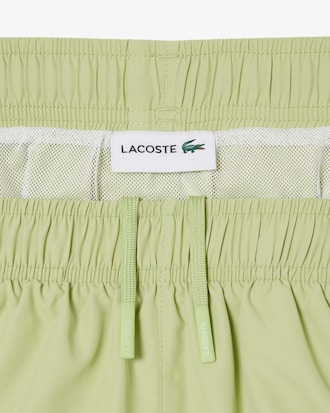 Short de ba&ntilde;o en bloques de color de largo medio