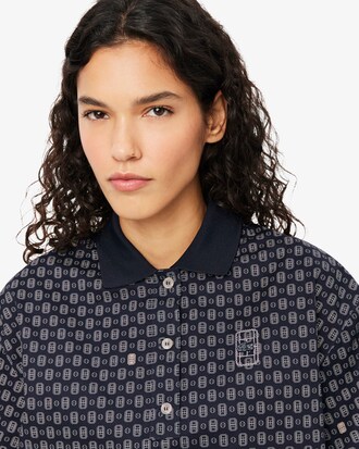 Polo oversize con estampado de tenis