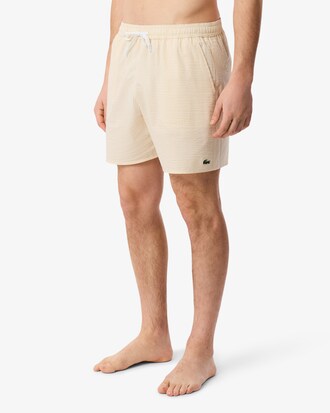 Short de ba&ntilde;o texturizado de rayas de largo medio