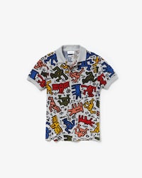 Polo de ni&ntilde;o Lacoste en minipiqu&eacute; con estampado de Keith Haring
