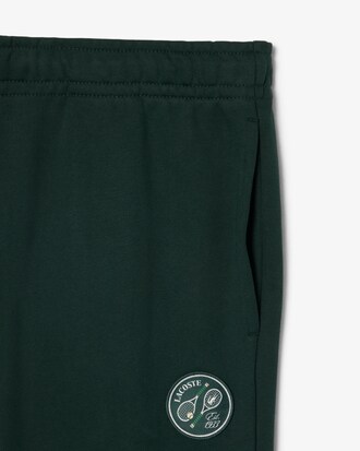 Pantal&oacute;n de ch&aacute;ndal de algod&oacute;n con insignia de tenis