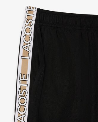 Pantalón corto de rayas con logotipo deportivo