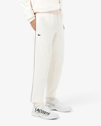 Pantal&oacute;n de ch&aacute;ndal con estampado de tenis