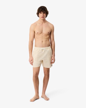 Short de ba&ntilde;o texturizado de rayas de largo medio