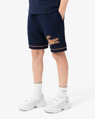Pantal&oacute;n corto deportivo de tafet&aacute;n de rayas
