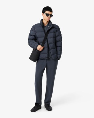 Polo Commuter de piqu&eacute; de corte ajustado con detalles de marca de jacquard