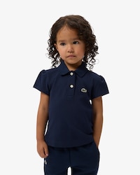 Polo de minipiqu&eacute; con cuello festoneado