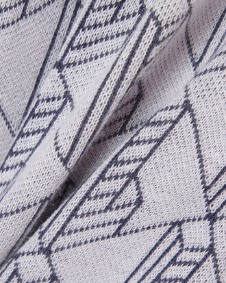 Pantal&oacute;n de ch&aacute;ndal con monograma