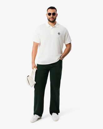 Polo de piqu&eacute; de corte cl&aacute;sico con insignia en contraste