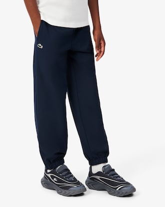Pantal&oacute;n de ch&aacute;ndal deportivo hidr&oacute;fugo