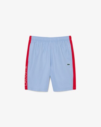 Pantal&oacute;n corto deportivo de tafet&aacute;n diamantado con franja en contraste