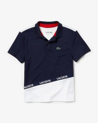 Polo de ni&ntilde;o Lacoste SPORT en piqu&eacute; color block transpirable con franja distintiva