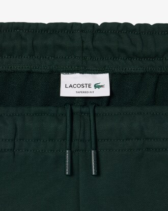 Pantal&oacute;n de ch&aacute;ndal de algod&oacute;n con insignia de tenis