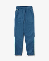 Pantal&oacute;n de deporte de ni&ntilde;o Lacoste SPORT color block con ribete a contraste