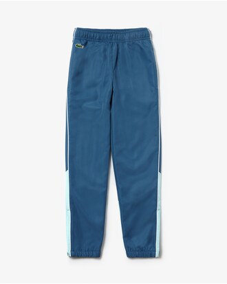 Pantal&oacute;n de deporte de ni&ntilde;o Lacoste SPORT color block con ribete a contraste