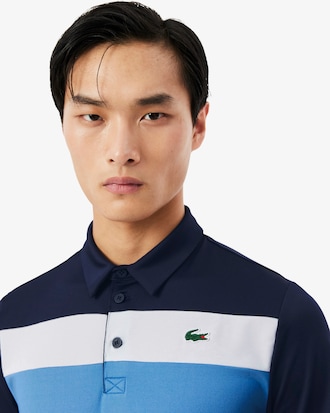 Polo de golf el&aacute;stico con bloques de color Ultra-Dry