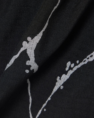 Pantal&oacute;n corto de tenis forrado con estampado reflectante