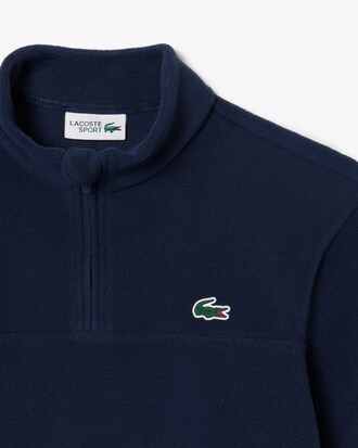 Top de golf con cremallera corta de forro polar