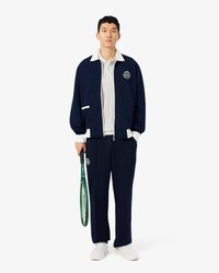 Polo de tenis cl&aacute;sico con insignia decorativa Ultra Dry