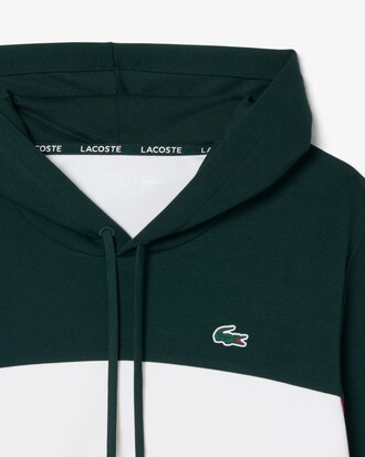 Sudadera deportiva con capucha y cremallera y bloques de color
