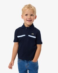 Polo de petit piqu&eacute; con bloques de color