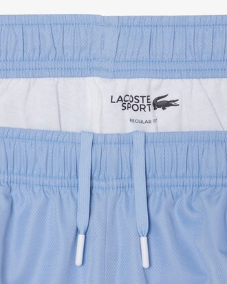 Pantal&oacute;n corto deportivo de tafet&aacute;n diamantado con franja en contraste