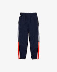 Pantal&oacute;n de deporte de ni&ntilde;o Lacoste SPORT color block con ribete a contraste