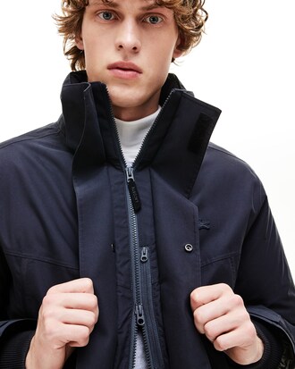 Parka de hombre acolchada corta con capucha de piel sint&eacute;tica