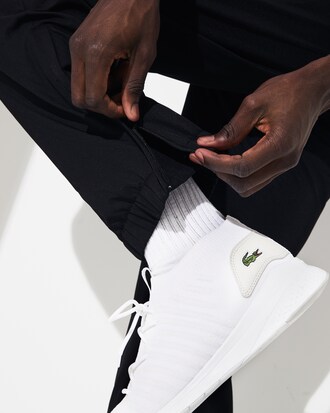 Pantal&oacute;n de deporte de hombre Lacoste SPORT color block con franjas distintivas