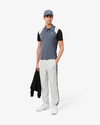 Pantal&oacute;n de ch&aacute;ndal deportivo con bloques de color