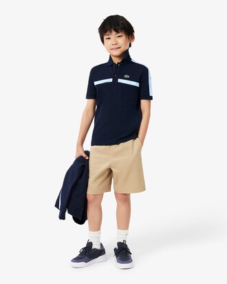 Polo de petit piqu&eacute; con bloques de color