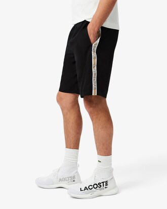 Pantalón corto de rayas con logotipo deportivo