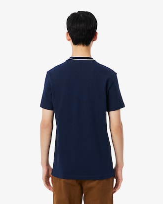 Camiseta de piqu&eacute; el&aacute;stico con cuello de rayas