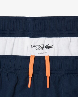 Pantal&oacute;n corto deportivo de tafet&aacute;n diamantado con ribete en contraste