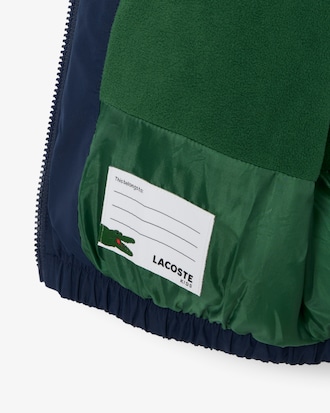 Chaqueta acolchada con capucha y cocodrilo bordado