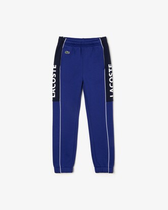 Pantal&oacute;n de deporte de ni&ntilde;o Lacoste SPORT en felpa color block con inscripci&oacute;n