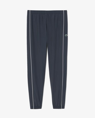 Pantal&oacute;n de ch&aacute;ndal deportivo hidr&oacute;fugo con ribete en contraste
