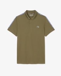 Polo de tenis con raya de la marca Ultra-Dry