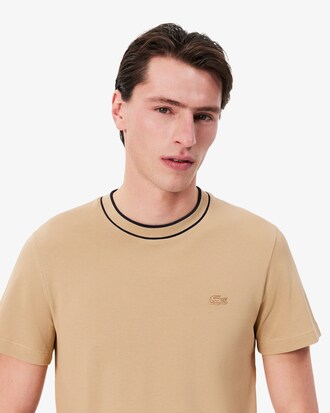 Camiseta de piqué elástico con cuello de rayas