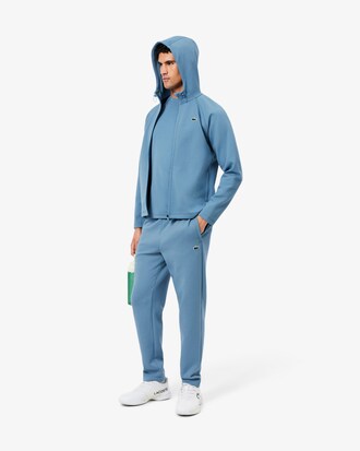 Sudadera deportiva el&aacute;stica con capucha y cremallera