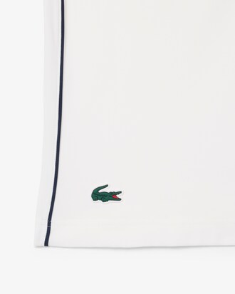 Polo de tenis cl&aacute;sico con insignia decorativa Ultra Dry