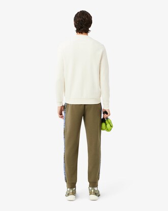 Pantal&oacute;n de ch&aacute;ndal de tenis con raya de logotipo