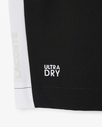 Pantal&oacute;n corto deportivo de tafet&aacute;n diamantado con bloques de color