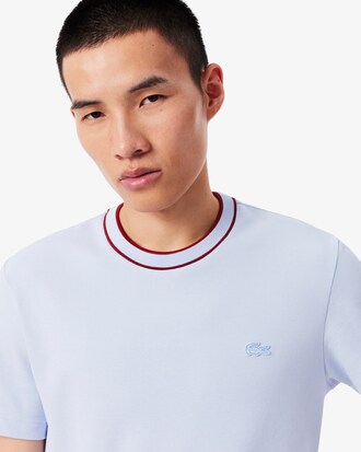 Camiseta de piqu&eacute; el&aacute;stico con cuello de rayas