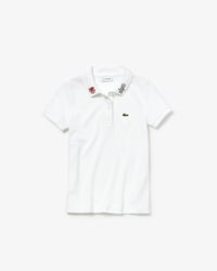 Polo de ni&ntilde;a Lacoste en petit piqu&eacute; de algod&oacute;n con estampados de Keith Haring