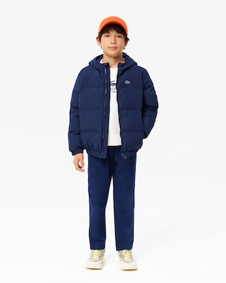 Chaqueta acolchada con capucha y cocodrilo bordado