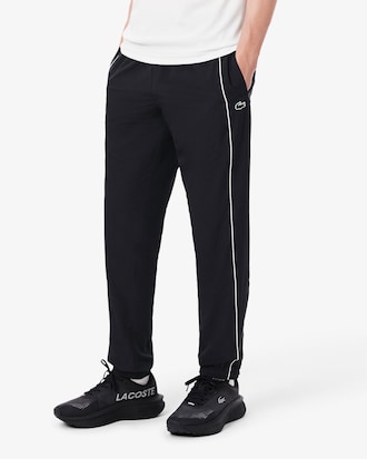 Pantal&oacute;n de ch&aacute;ndal deportivo hidr&oacute;fugo con ribete en contraste