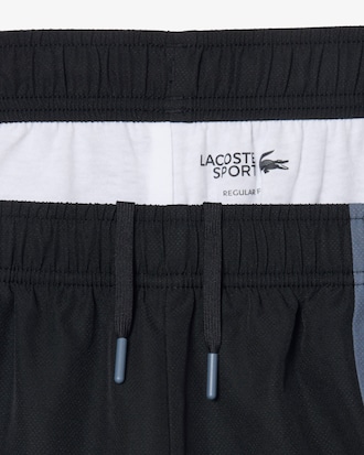 Pantal&oacute;n corto deportivo hidr&oacute;fugo con bloques de color