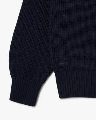 Jersey con cuello polo de punto de canal&eacute; perlado con insignia en contraste